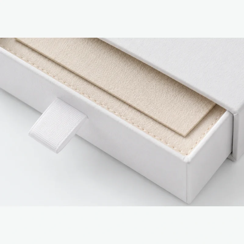 Custom White Drawer Cardboard Jewelry Box logo and closure detail Custom White Drawer Cardboard Jewelry Box logo and closure detail