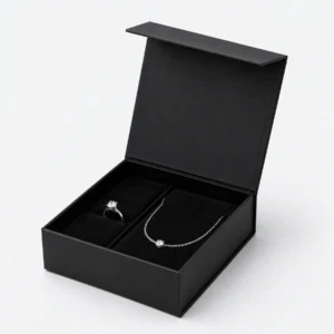 Open black magnetic jewelry gift box with ring and necklace insert Open black magnetic jewelry gift box with ring and necklace insert