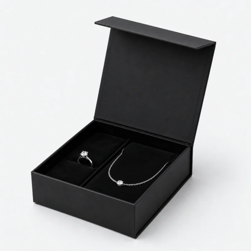 Open black magnetic jewelry gift box with ring and necklace insert Open black magnetic jewelry gift box with ring and necklace insert