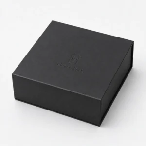 Closed black paper jewelry gift box with subtle debossed logo Closed black paper jewelry gift box with subtle debossed logo