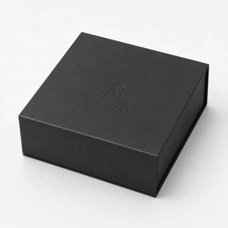 Closed black paper jewelry gift box with subtle debossed logo Closed black paper jewelry gift box with subtle debossed logo