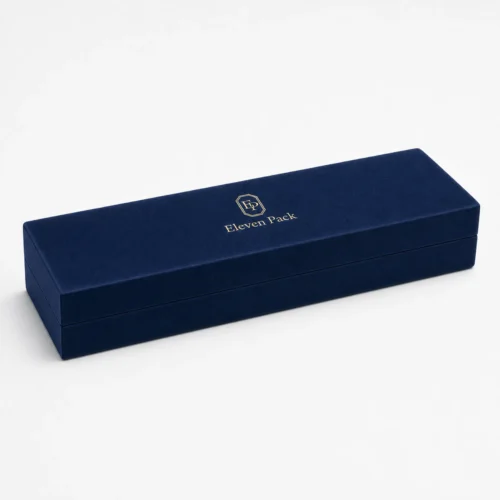 Closed navy velvet necklace box with gold ElevenPack logo