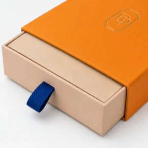 Close-up of the full-depth beige drawer fitting inside an orange sleeve