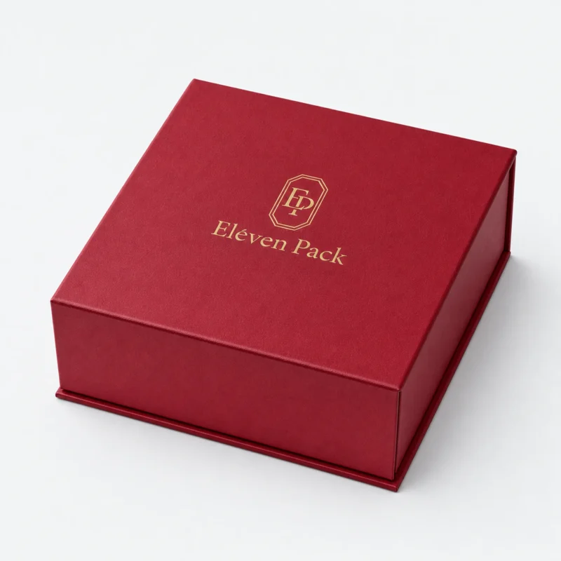 Closed red paper magnetic flip top gift box with gold foil logo Closed red paper magnetic flip top gift box with gold foil logo