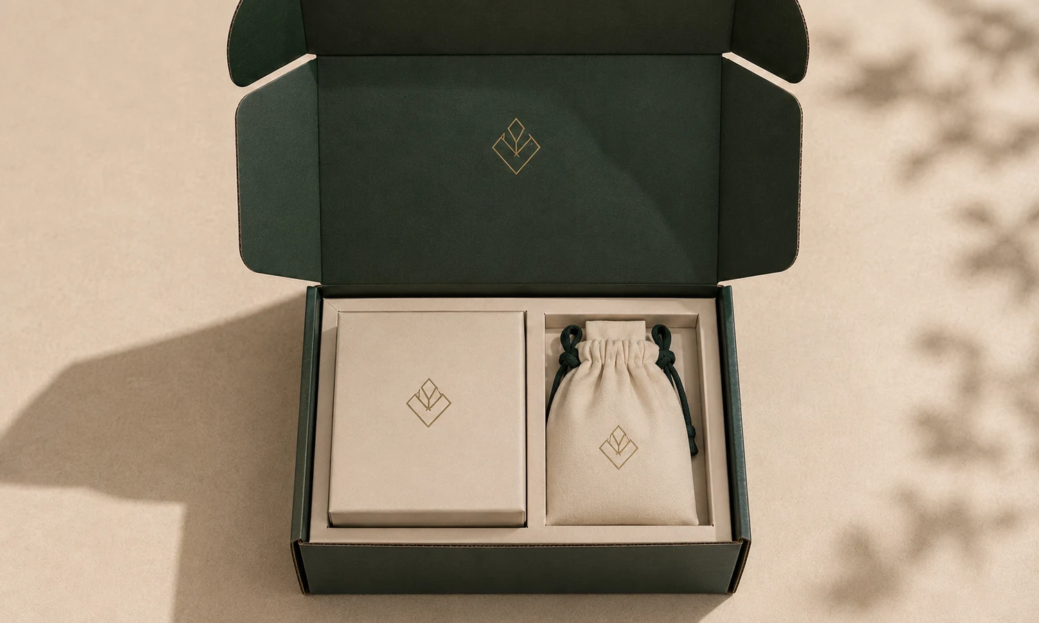 Compact cream jewelry packaging set on a clean pale shelf