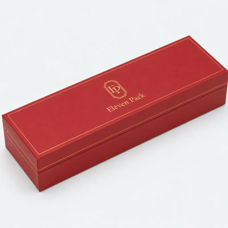 Closed long red leather bangle box with gold logo and border