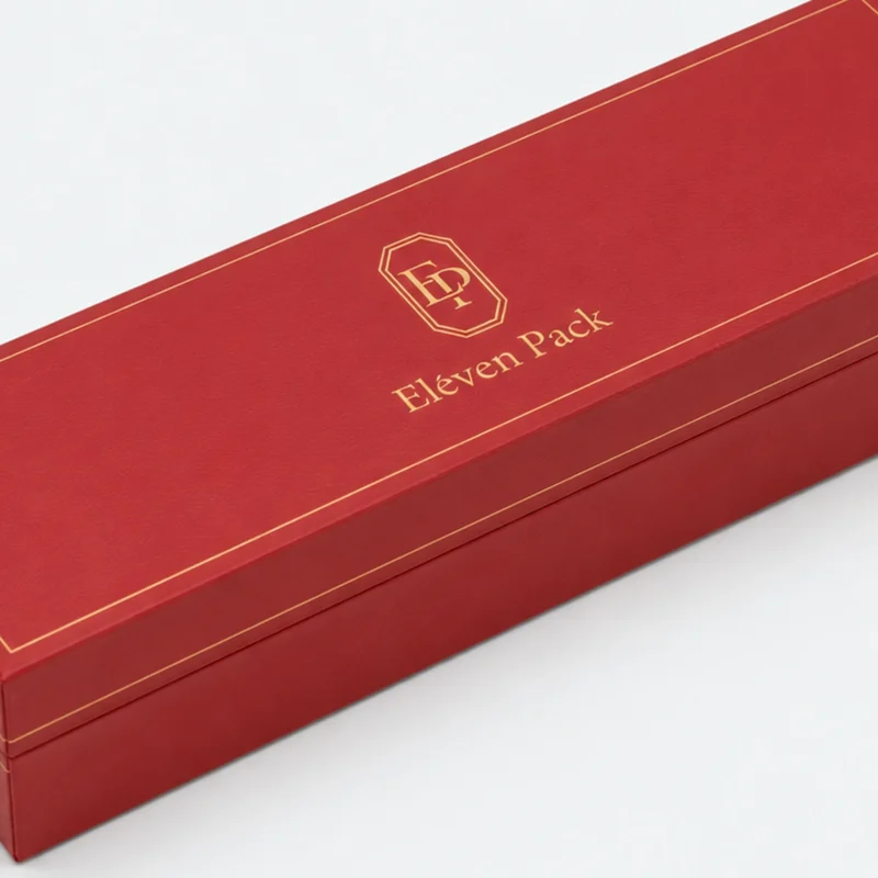 Red leather bangle box detail showing hinge and gold edge finish