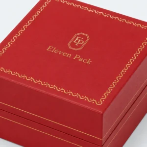 Red leather watch box lid detail with gold decorative finishing Red leather watch box lid detail with gold decorative finishing
