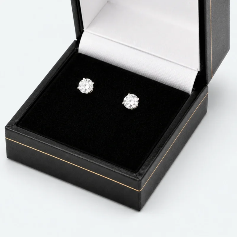 Two-post stud earring retention detail on a fitted black velvet pad Two-post stud earring retention detail on a fitted black velvet pad