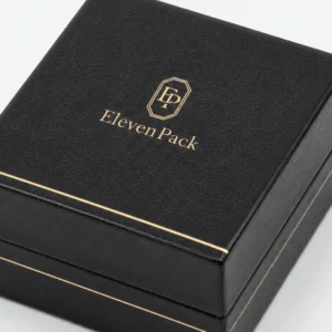 Black leather earring box detail showing fine gold edge finishing Black leather earring box detail showing fine gold edge finishing