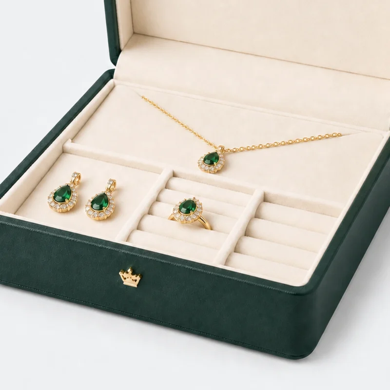 Ivory compartment layout holding a coordinated green stone jewelry set