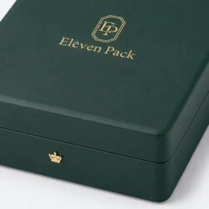 Green leather jewelry box detail with gold crown-shaped front closure