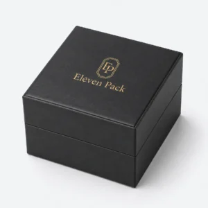 Closed black genuine leather watch box with centered gold logo
