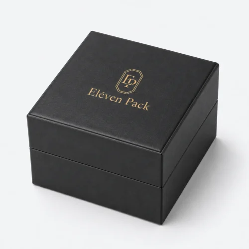 Closed black genuine leather watch box with centered gold logo