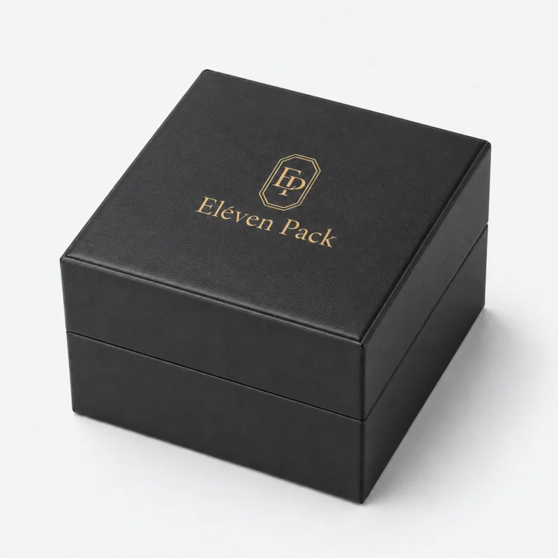 Closed black genuine leather watch box with centered gold logo