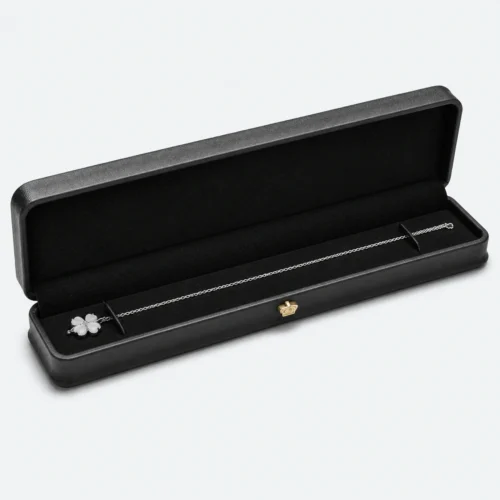 Open long black genuine leather necklace box with a fitted black insert