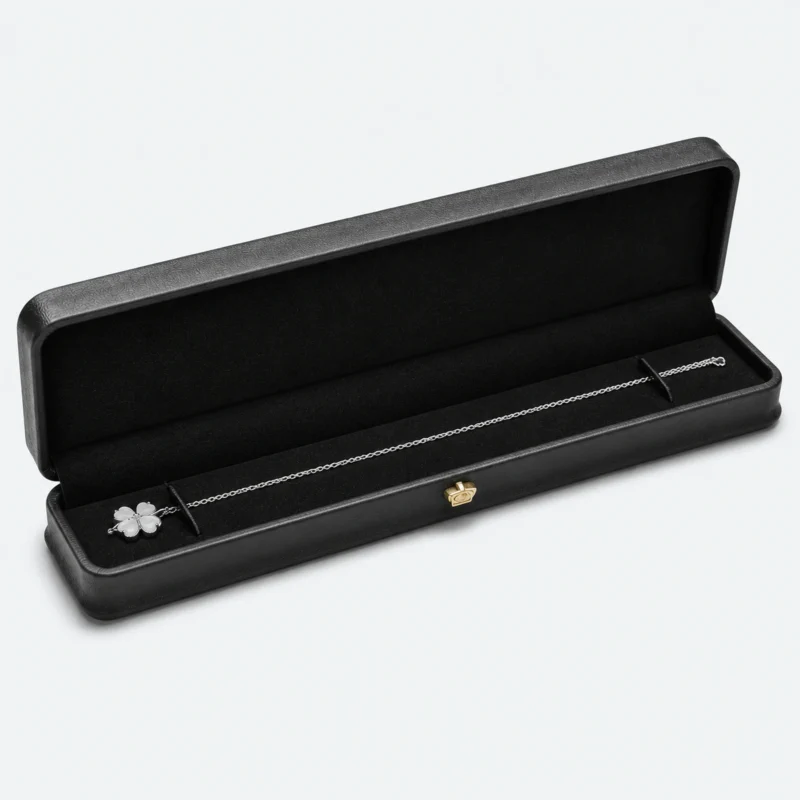 Open long black genuine leather necklace box with a fitted black insert Open long black genuine leather necklace box with a fitted black insert
