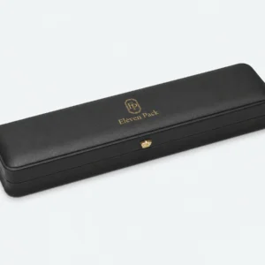 Closed black genuine leather necklace box with gold logo and button clasp Closed black genuine leather necklace box with gold logo and button clasp