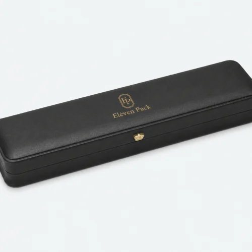 Closed black genuine leather necklace box with gold logo and button clasp