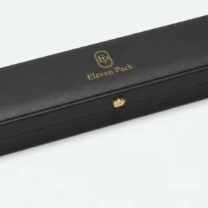Black leather necklace box detail with rounded edge and gold button clasp Black leather necklace box detail with rounded edge and gold button clasp