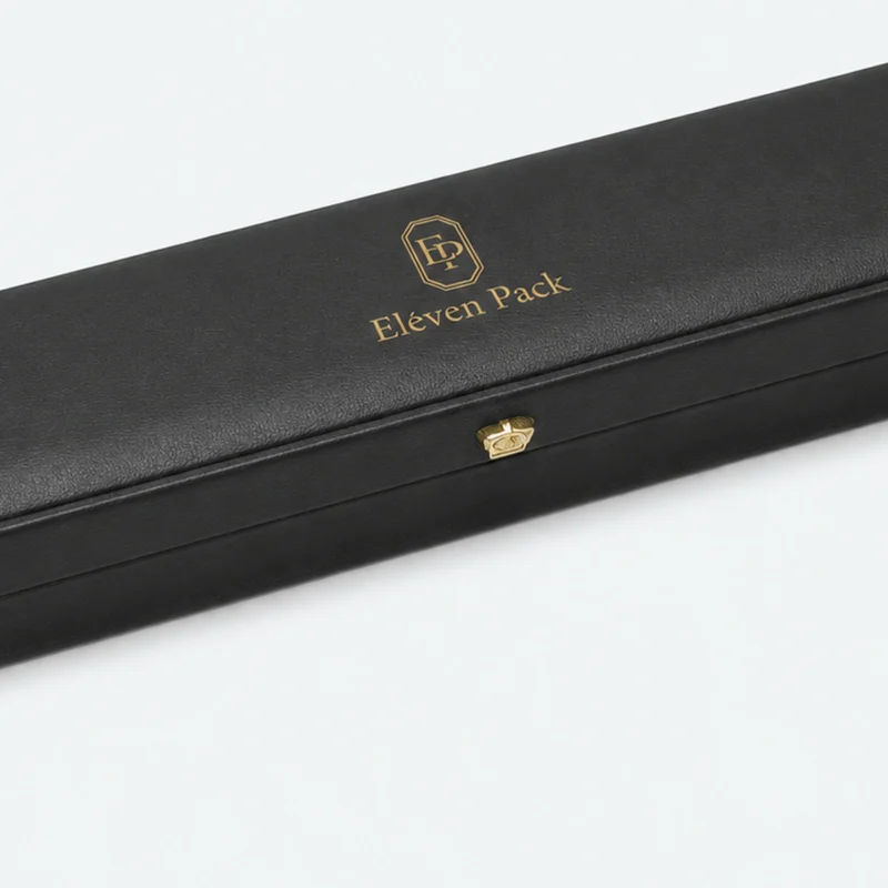 Black leather necklace box detail with rounded edge and gold button clasp Black leather necklace box detail with rounded edge and gold button clasp