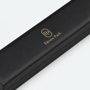 Closed black leather bracelet box detail showing lid seam and finish