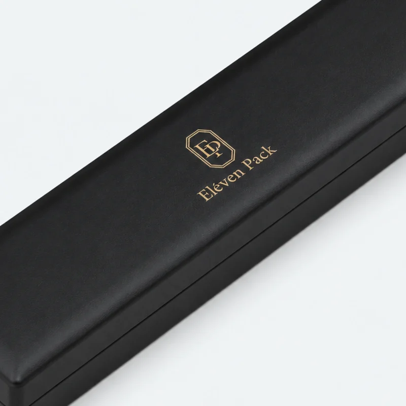 Closed black leather bracelet box detail showing lid seam and finish