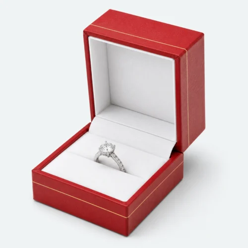 Open custom red leather hinged ring box with a white fitted ring insert Open custom red leather hinged ring box with a white fitted ring insert