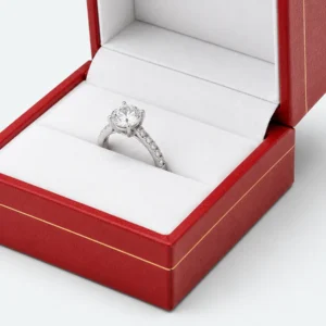White ring-roll seating detail inside a red leather jewelry box