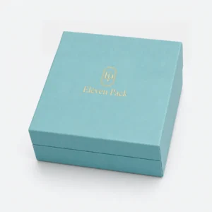 Closed turquoise paper jewelry gift box with gold Eleven Pack logo