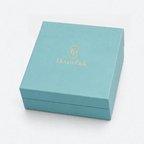 Closed turquoise paper jewelry gift box with gold Eleven Pack logo