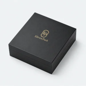 Closed black rigid paper jewelry box with gold Eleven Pack logo