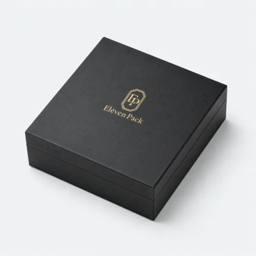 Closed black rigid paper jewelry box with gold Eleven Pack logo
