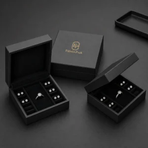 Three black hinged jewelry boxes with matching multi-slot inserts