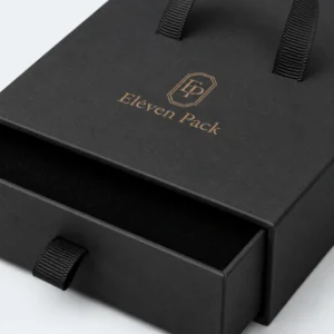 Close-up of black ribbon pull and aligned jewelry box drawer sleeve