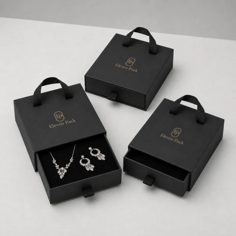 Three black drawer jewelry boxes in a wholesale packaging assortment