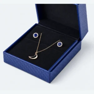 Black fitted insert holding a pendant necklace and matching earrings