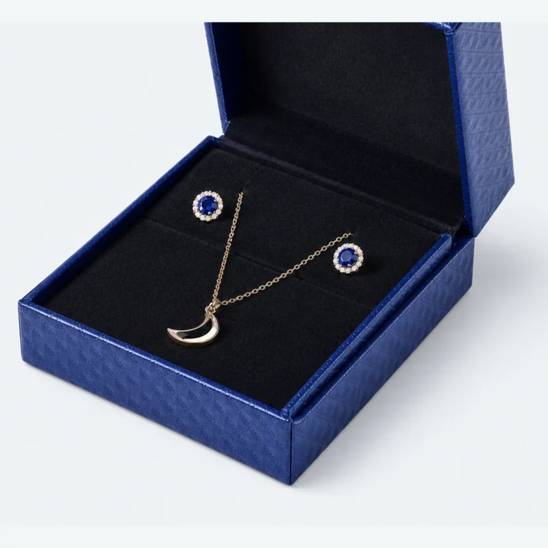 Black fitted insert holding a pendant necklace and matching earrings