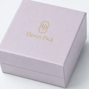 Close-up of pale lilac paper wrap and the lid-base seam