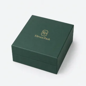 Closed green paper jewelry box with gold Eleven Pack logo