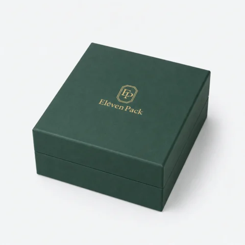 Closed green paper jewelry box with gold Eleven Pack logo