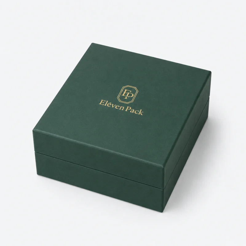 Closed green paper jewelry box with gold Eleven Pack logo