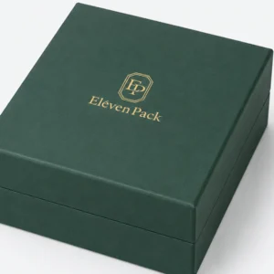 Close-up of the green paper corner, hinge and lid-base seam