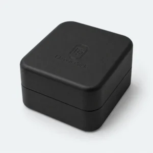 Closed black flip-top earring box with debossed logo