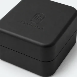 Close-up of the rounded black lid edge and closure seam