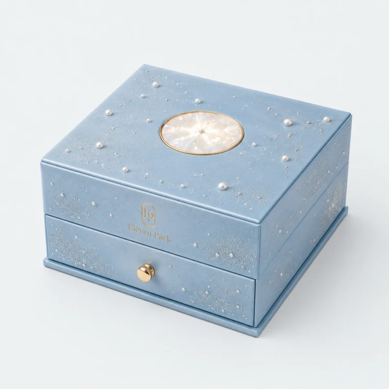Closed blue cardboard jewelry organizer with pearl star decoration