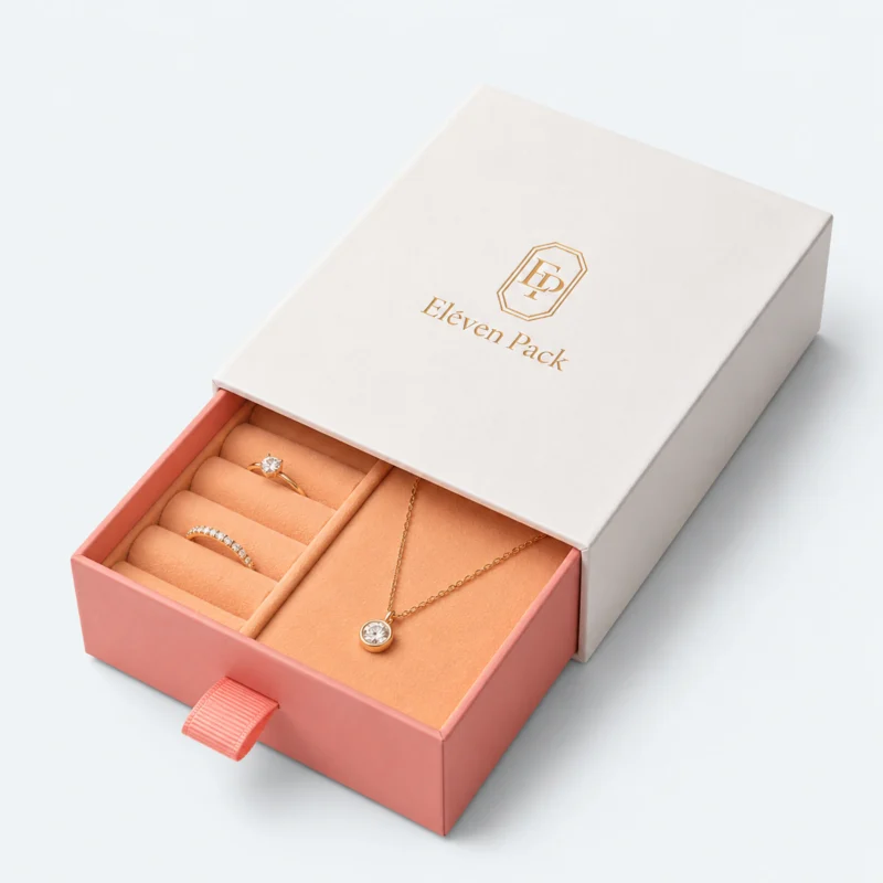 Open two-tone paper drawer gift box with coral insert for rings and a necklace