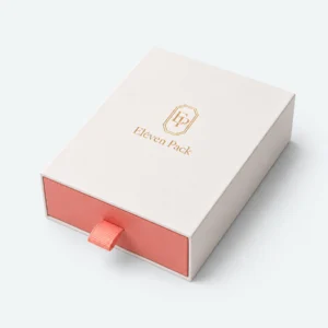 Closed white and coral paper drawer jewelry box with fabric pull tab