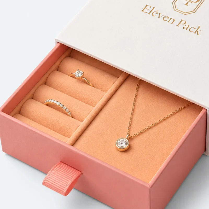 Close-up of coral ring rolls and divided necklace cavity inside the drawer box
