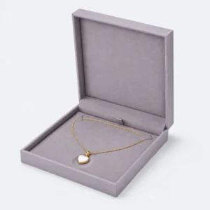 Open gray lilac linen necklace box with two chain tabs and centered heart pendant